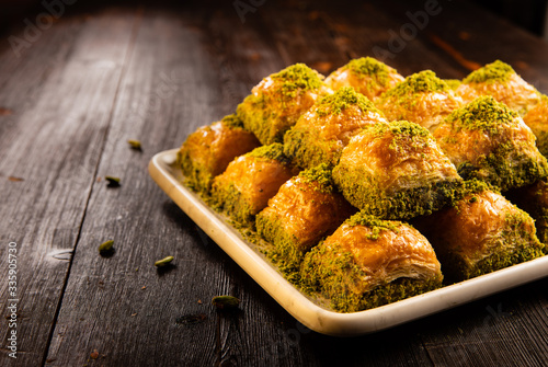 Turkish traditional dessert baklava with pistachio and walnut close up photo
