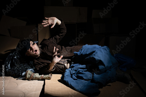 A middle-aged homeless man defends himself against danger. © fotodrobik