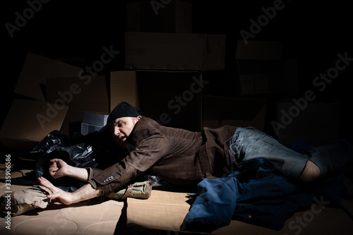 A middle-aged homeless man became alcoholic because of his situation. © fotodrobik