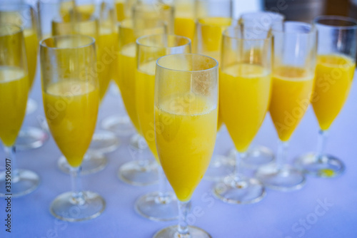 Party preparing. Glasses filled with orange juice.