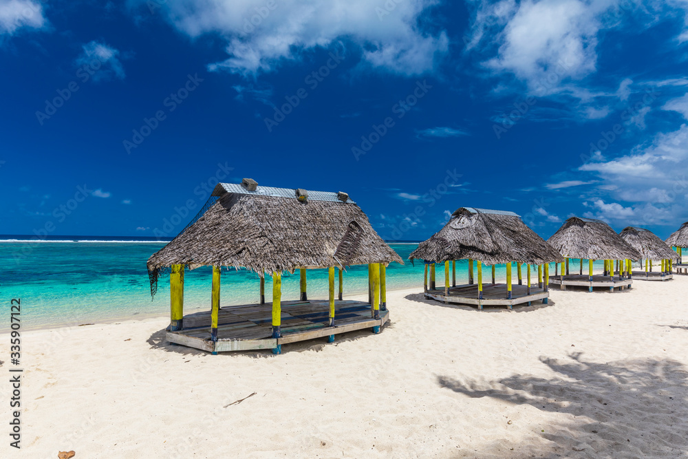 Lalomanu beach with open huts called fales, south side of Upolu Island, Samoa