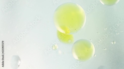 special details of drops of oil in blue water