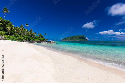 Fototapeta Naklejka Na Ścianę i Meble -  Vibrant tropical beach with palm trees, Upolu, Samoa