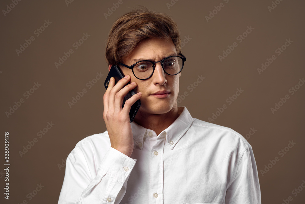 young man talking on the phone young man talking on the phone