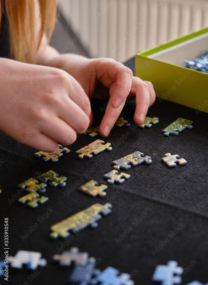 woman puzzles at home woman puzzles at home