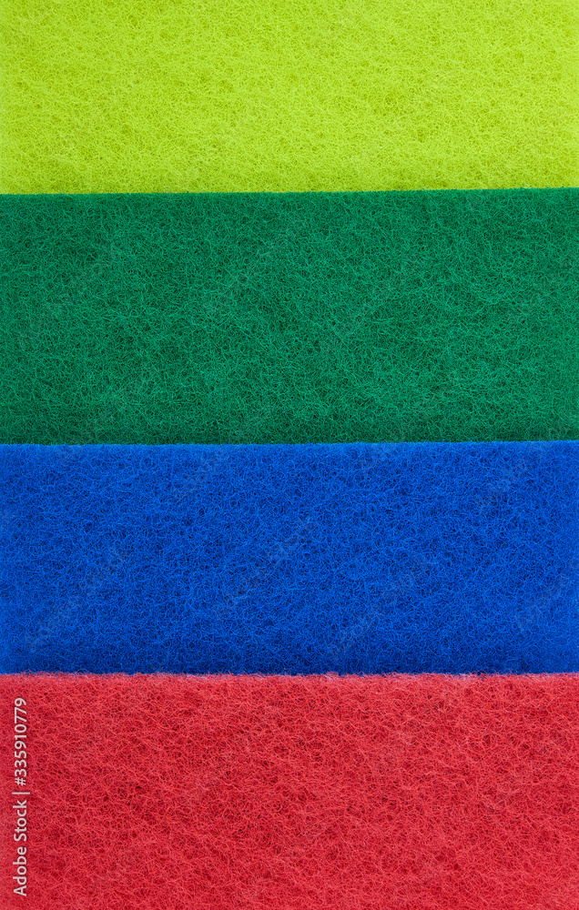 Fototapeta premium fiber scraper red blue green yellow close up background