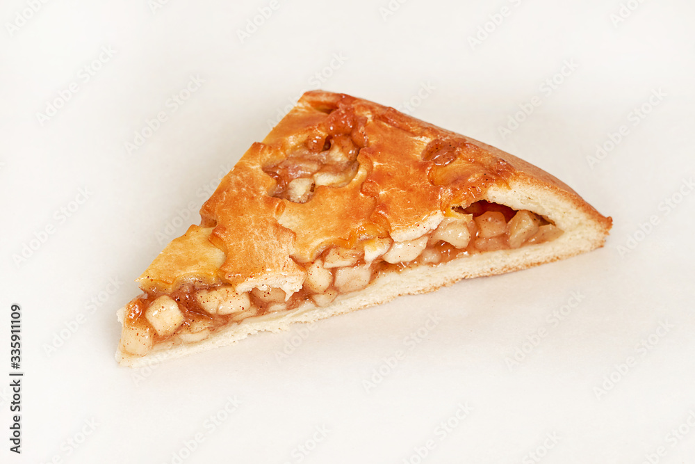Pie stuffed with apples. Fresh pastries. Closeup on a light background Pie stuffed with apples. Fresh pastries. Closeup on a light background