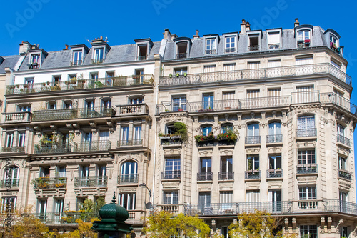 Paris, typical facade and windows, beautiful building in Montmartre
