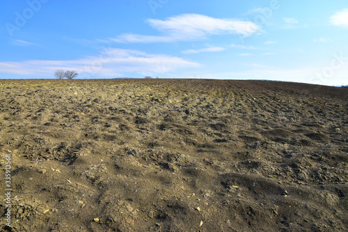 Soil field endangered by wind erosion landscape