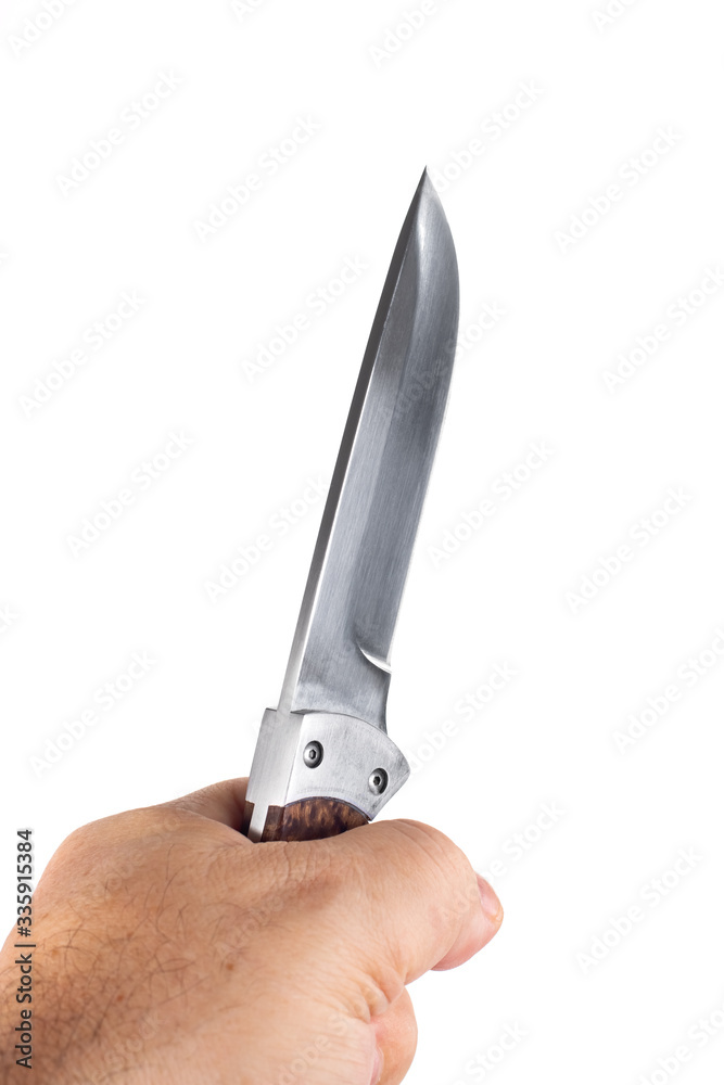 hunting knife in a hand isolated on white background hunting knife in a hand isolated on white background