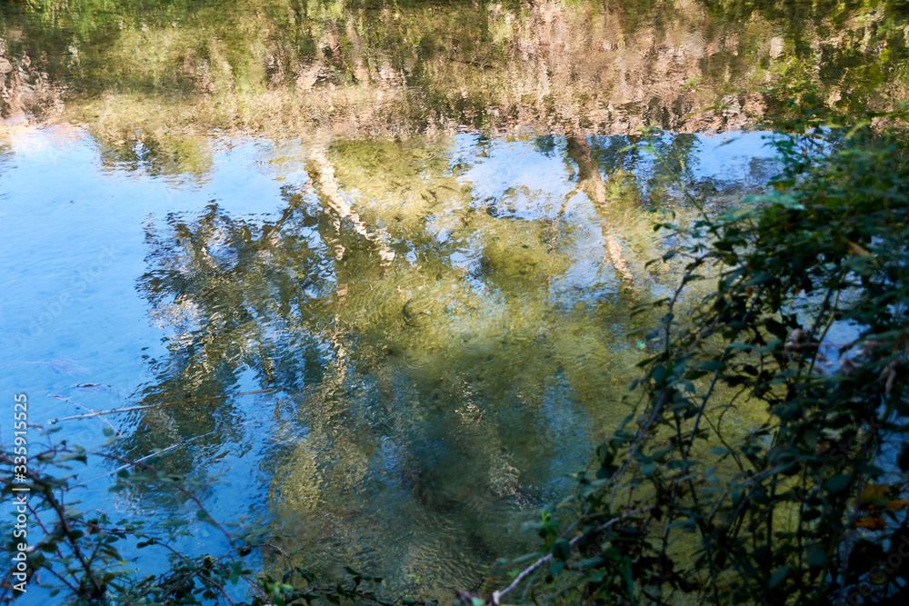 River of calm waters and with reflections River of calm waters and with reflections
