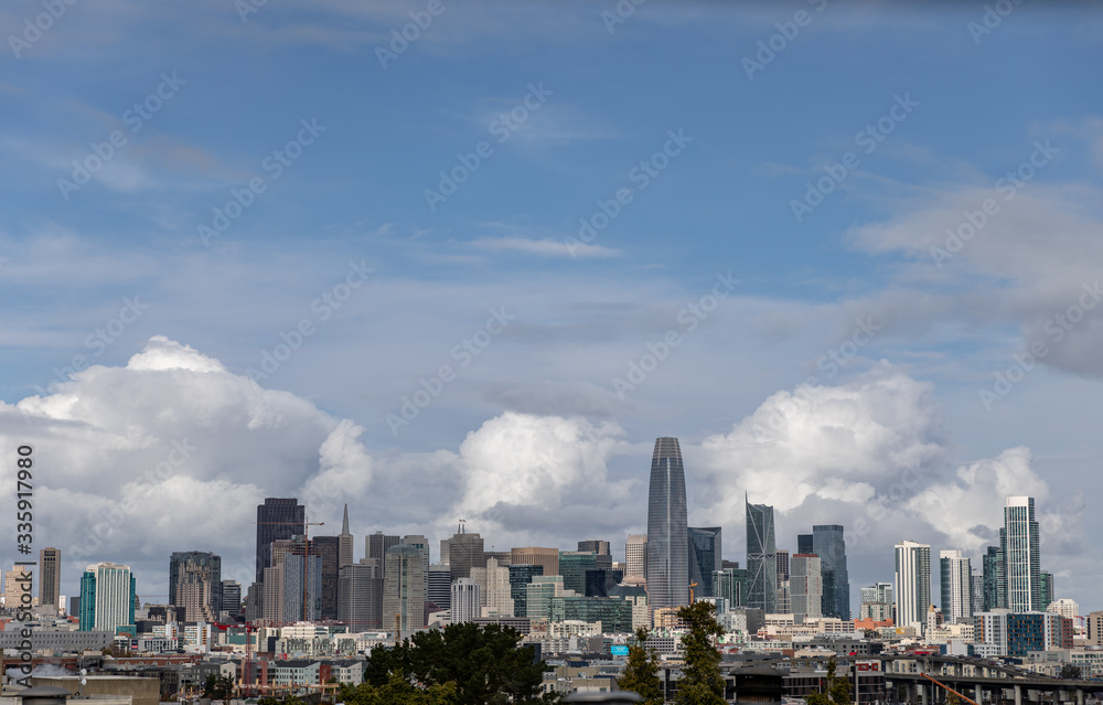 Skyline of buildings with clouds in background Skyline of buildings with clouds in background