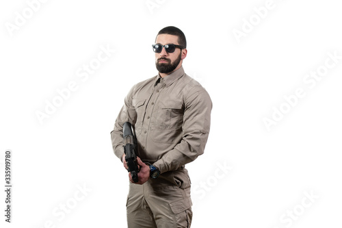 Military Man Holding Gun Isolated on White Background © Jale Ibrak