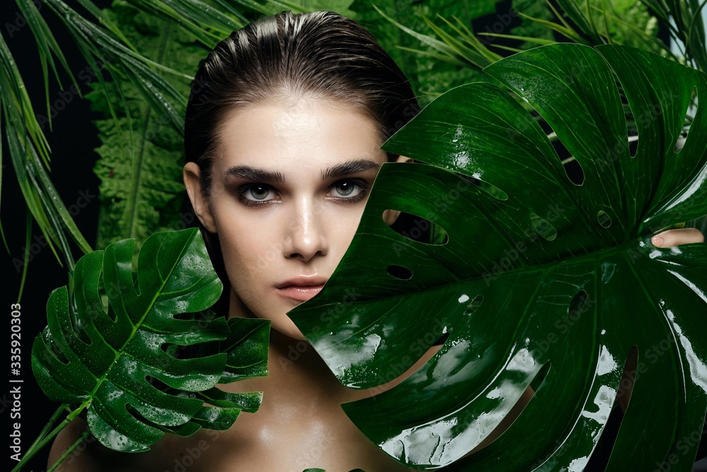 Woman nature walk lifestyle tropics vacation green leaves Woman nature walk lifestyle tropics vacation green leaves