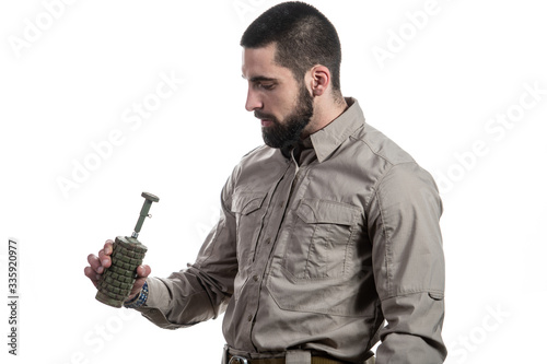 Young Man Holding a Bomb on White Background