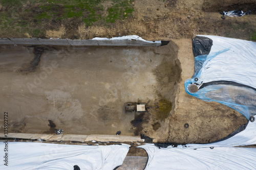 A feed pit near the farm where the tractor operates. photo