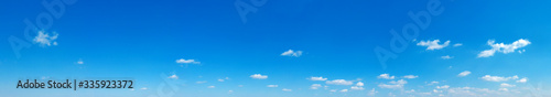 Blue sky background. Natural background. Panorama sky with tiny clouds