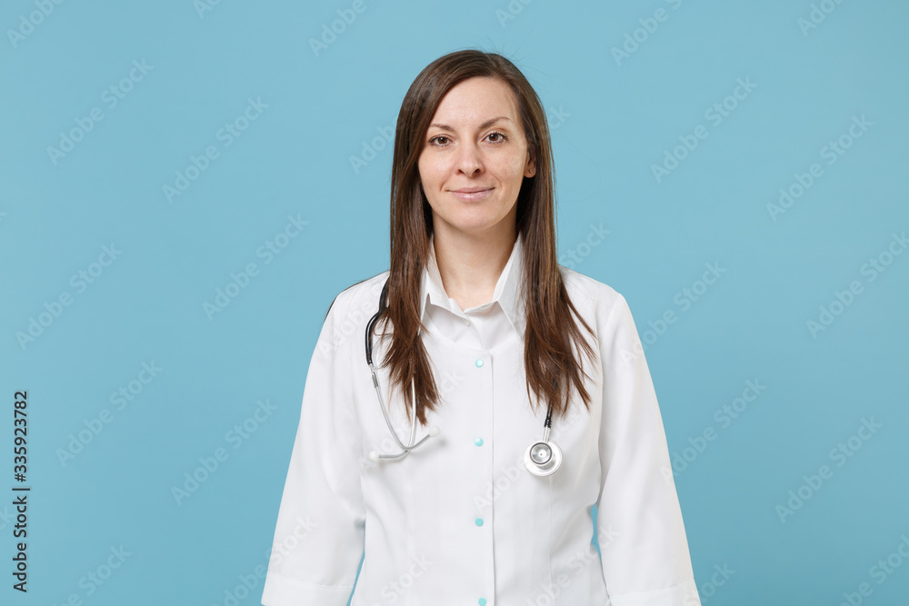 Doctor woman female in white medical suit gown isolated on blue background studio. Epidemic pandemic new rapidly spreading coronavirus 2019-ncov originating in Wuhan China, medicine flu virus concept. Doctor woman female in white medical suit gown isolated on blue background studio. Epidemic pandemic new rapidly spreading coronavirus 2019-ncov originating in Wuhan China, medicine flu virus concept.