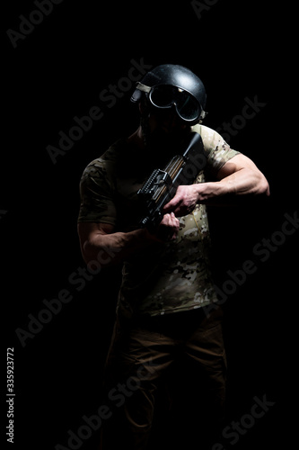 Warrior With Gun on a Black Background © Jale Ibrak