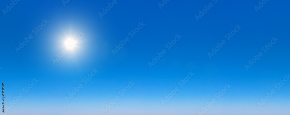 Obraz premium Blue Sky background with tiny Clouds. Panorama background