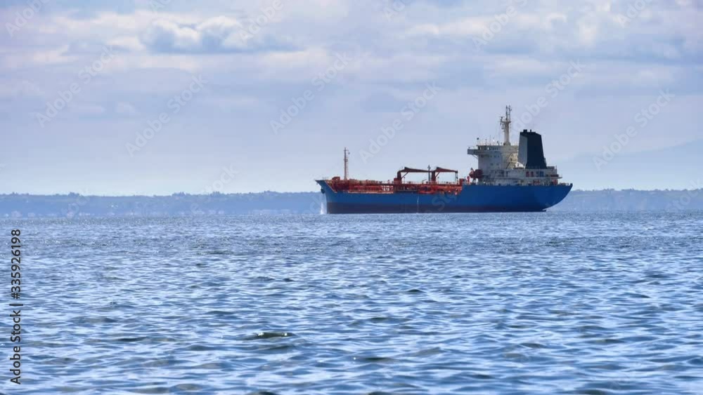 Cargo ship on the sea horizon Cargo ship on the sea horizon
