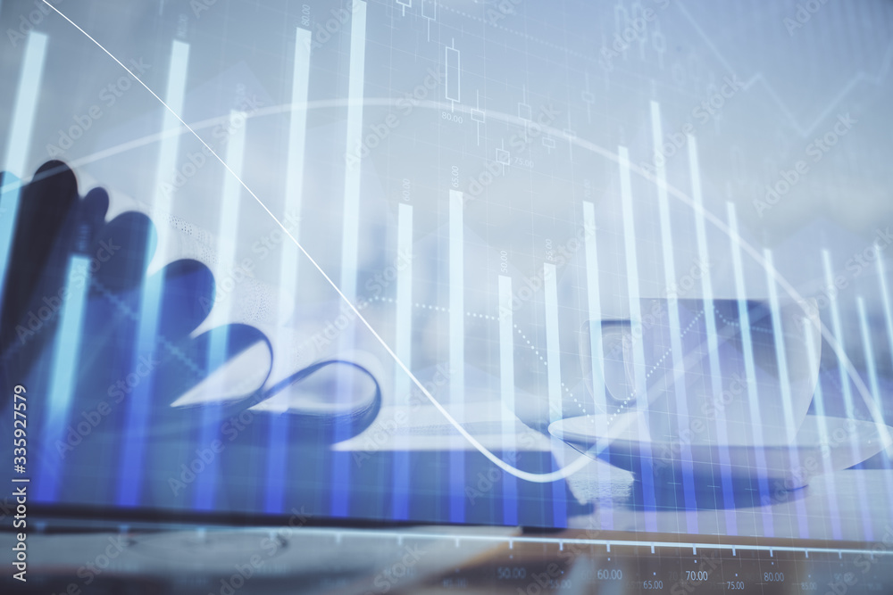 Double exposure of financial chart drawing and desktop with coffee and items on table background. Concept of forex market trading Double exposure of financial chart drawing and desktop with coffee and items on table background. Concept of forex market trading