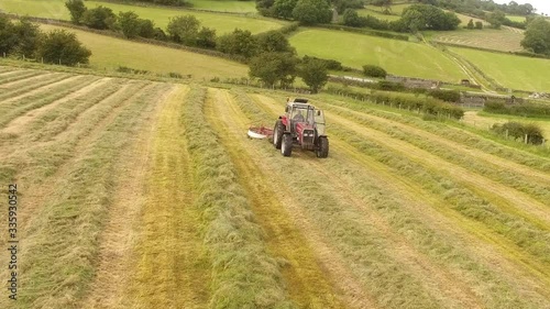 Massey Ferguson 390T rowing grass for silage  photo