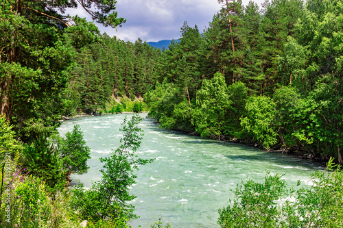 bolshoy zelenchuk river in the caucasus mountains on a sunny day photo