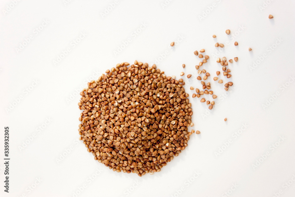 Buckwheat isolated on a white background. Useful cereals for cooking soups and porridges. Buckwheat isolated on a white background. Useful cereals for cooking soups and porridges.