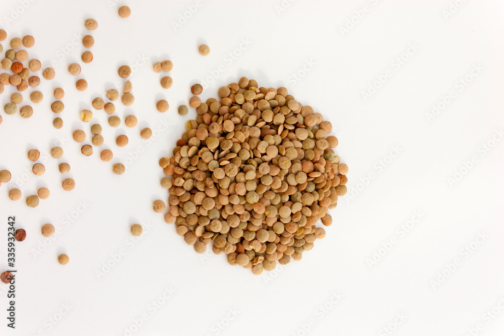 Isolated lentils on a white background. Useful legumes for cooking soups, porridge. Isolated lentils on a white background. Useful legumes for cooking soups, porridge.