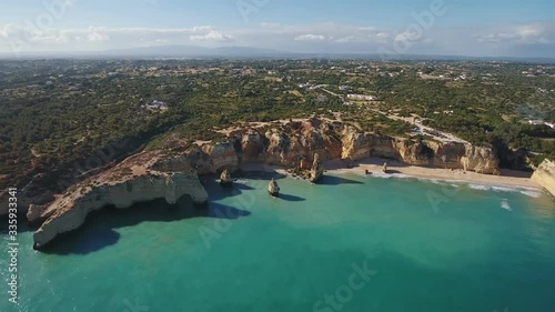 Aerial. Portuguese beach Marinha with cliffs in the form of an arch, aerial view. Algarve Albufeira.