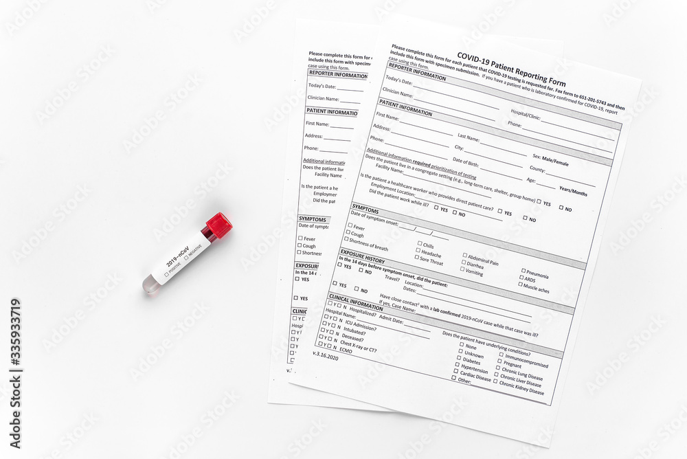 Obraz premium Test tube with blood test for coronavirus 2019-nCov. Patient's form with covid-19 test results. An outbreak of respiratory diseases. SARS.