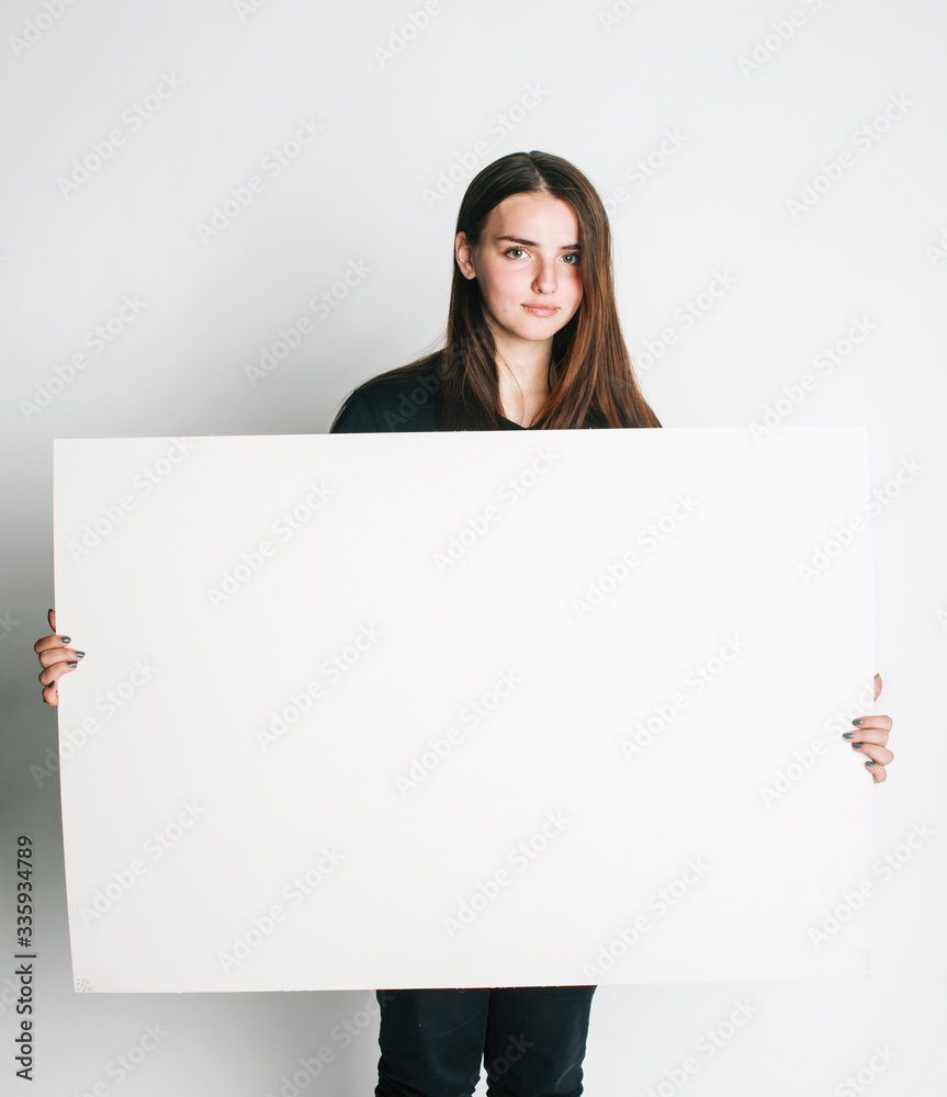 young pretty brunette girl with placard shit copyspace on white background wearing business costume student young pretty brunette girl with placard shit copyspace on white background wearing business costume student
