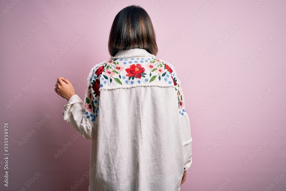Young beautiful woman wearing fashion urban clothes, model wearing casual street style standing over pink background Young beautiful woman wearing fashion urban clothes, model wearing casual street style standing over pink background