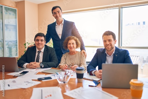 Business lawyers workers meeting at law firm office. Professional executive partners working on finance strategry at the workplace. Smiling happy and cofident to the camera. photo