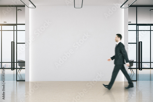 Businessman walking in meeting room