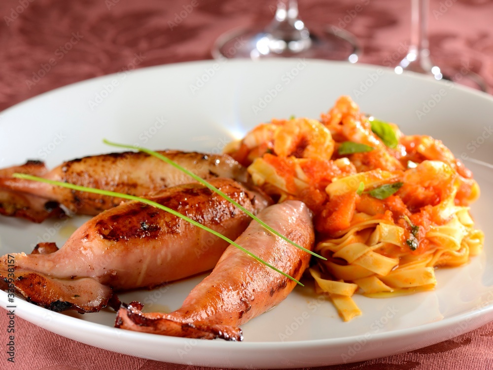 Squid stuffed with fresh campignon and fettuccini with shrimp sauce