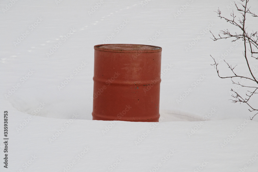 red barrel on a white snow background.