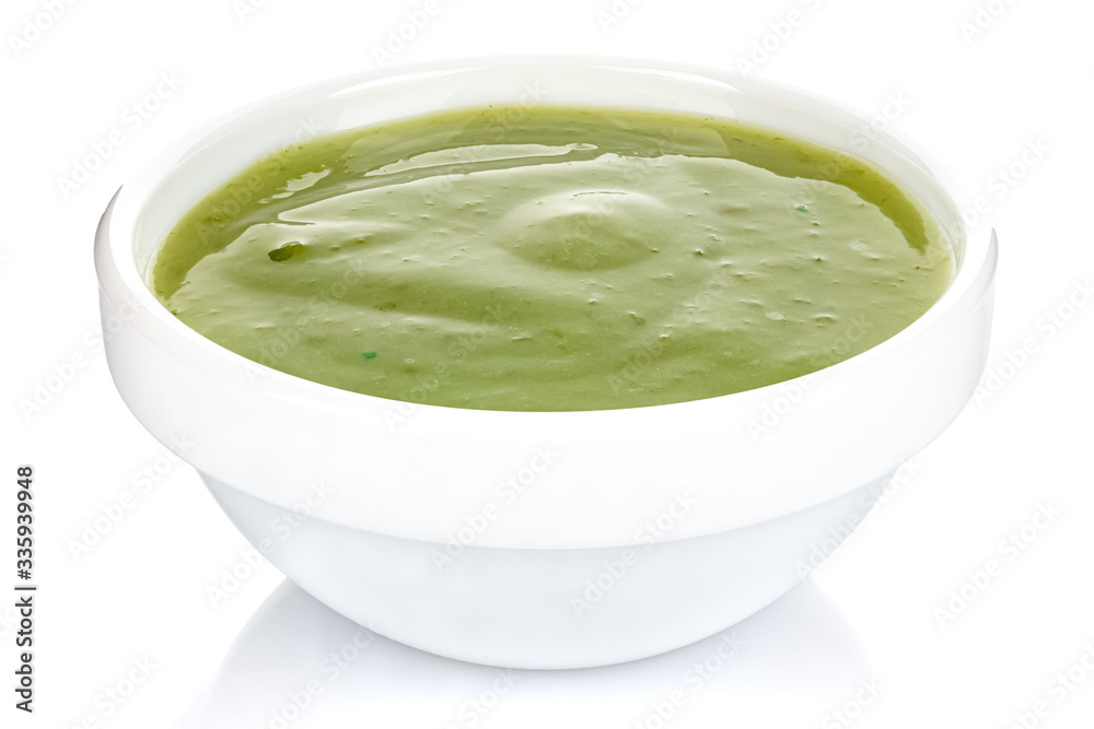 Green chili sauce with lime in a small white ceramic round bowl isolated on white background Green chili sauce with lime in a small white ceramic round bowl isolated on white background