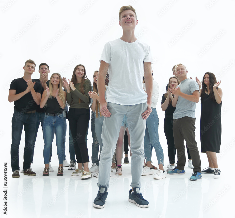 casual guy standing in front of a group of diverse young people