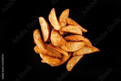 A tasty home made freshly cut potato wedges perfect for home delivery and recommended for food menu content.