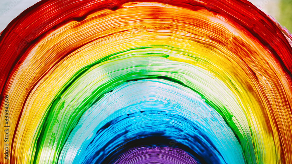 Close-up photo of painting rainbow on window - obrazy, fototapety, plakaty 