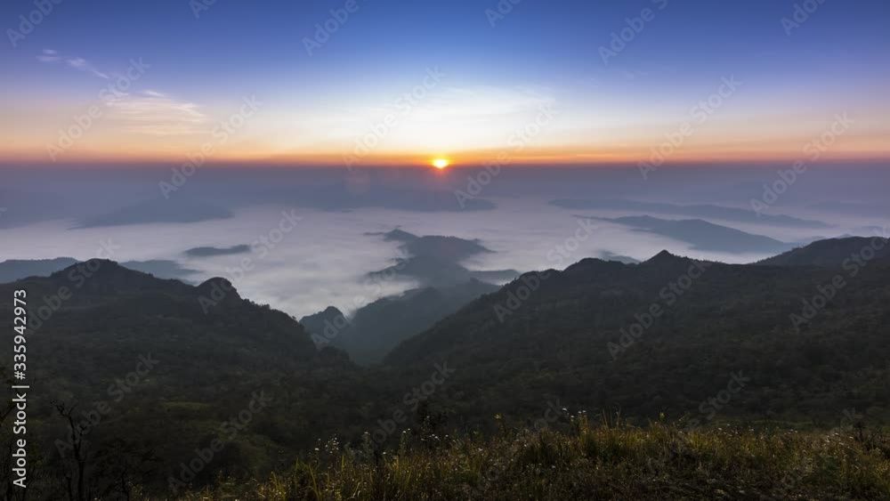 landscape view of sunrise above on mountain with cloudy movement at winter timing located at north of Thailand landscape view of sunrise above on mountain with cloudy movement at winter timing located at north of Thailand