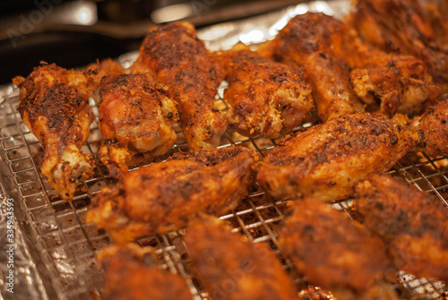 Close up of a rack full of home made chicken wings with selective focus