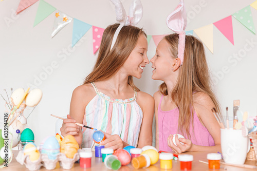 Happy easter. Beautiful little kids wearing bunny ears on Easter day.