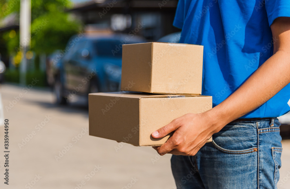 delivery man with box he protective face mask, service customer in front of the house delivery man with box he protective face mask, service customer in front of the house