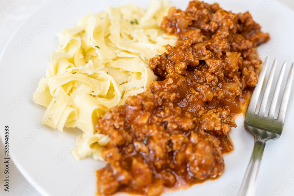 Minced meat sauce served with homemade pasta Minced meat sauce served with homemade pasta