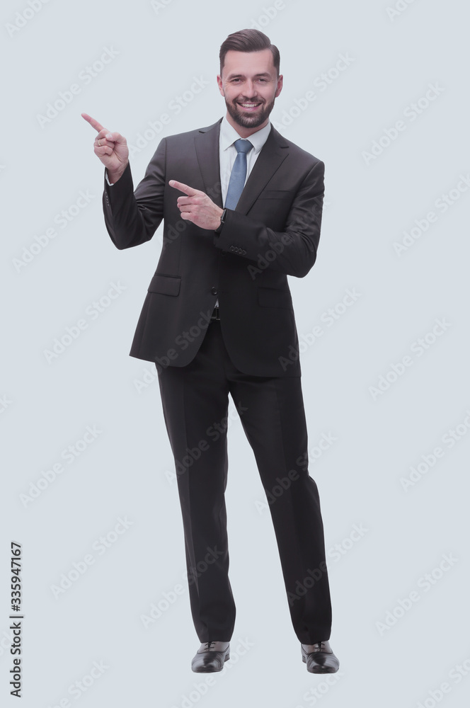smiling handsome businessman pointing to copy space. isolated on white smiling handsome businessman pointing to copy space. isolated on white
