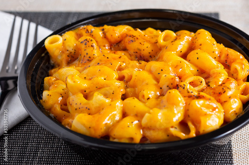 Photography A view of a bowl of macaroni and cheese, in a restaurant or kitchen setting