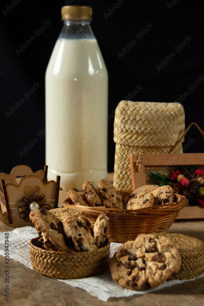 milk and cookies on wooden